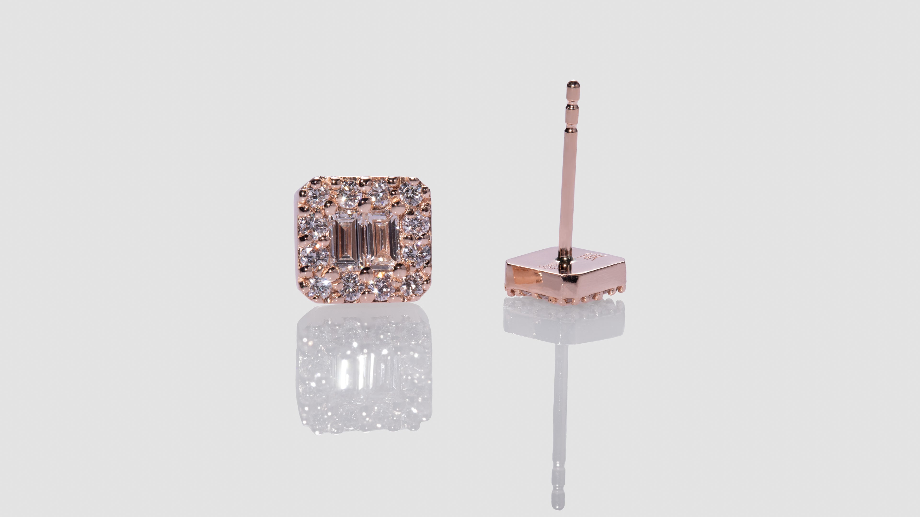 Tapered baguette diamond earrings in platinum | Jon Dibben